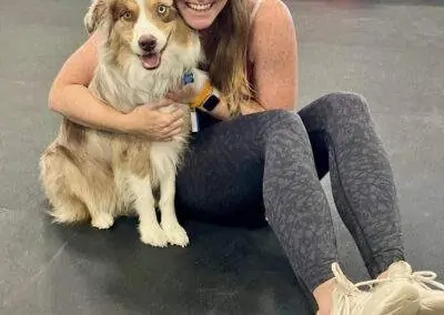 St. Louis woman and her dog at Zoom Room dog training in Crestwood, Missouri.